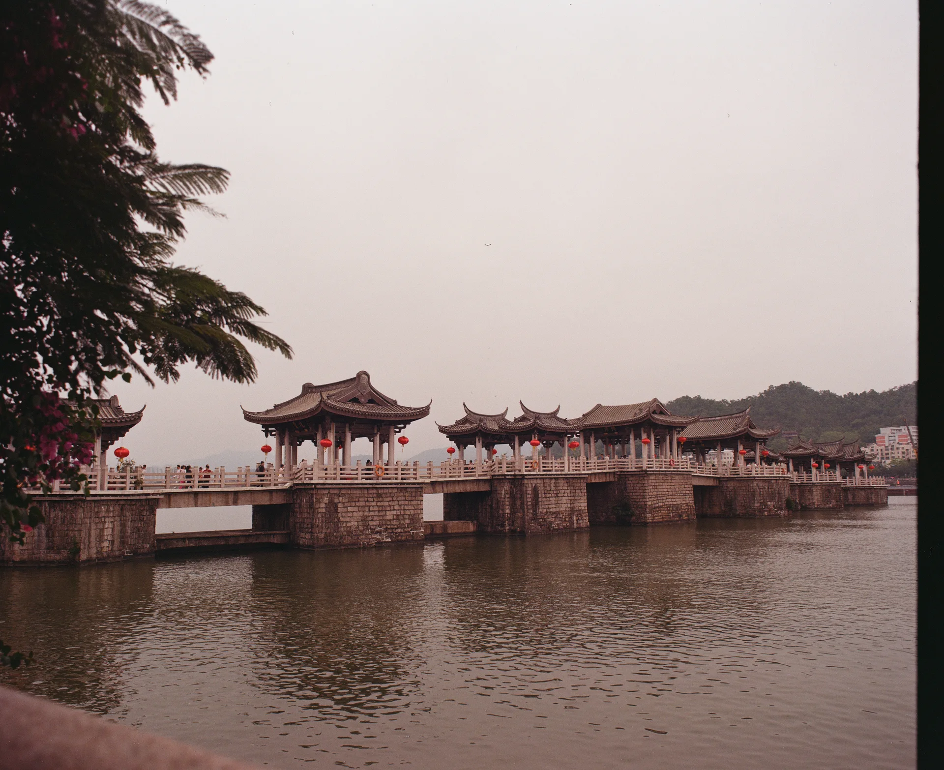 Pavilions along a stone bridge over the river in Chaozhou