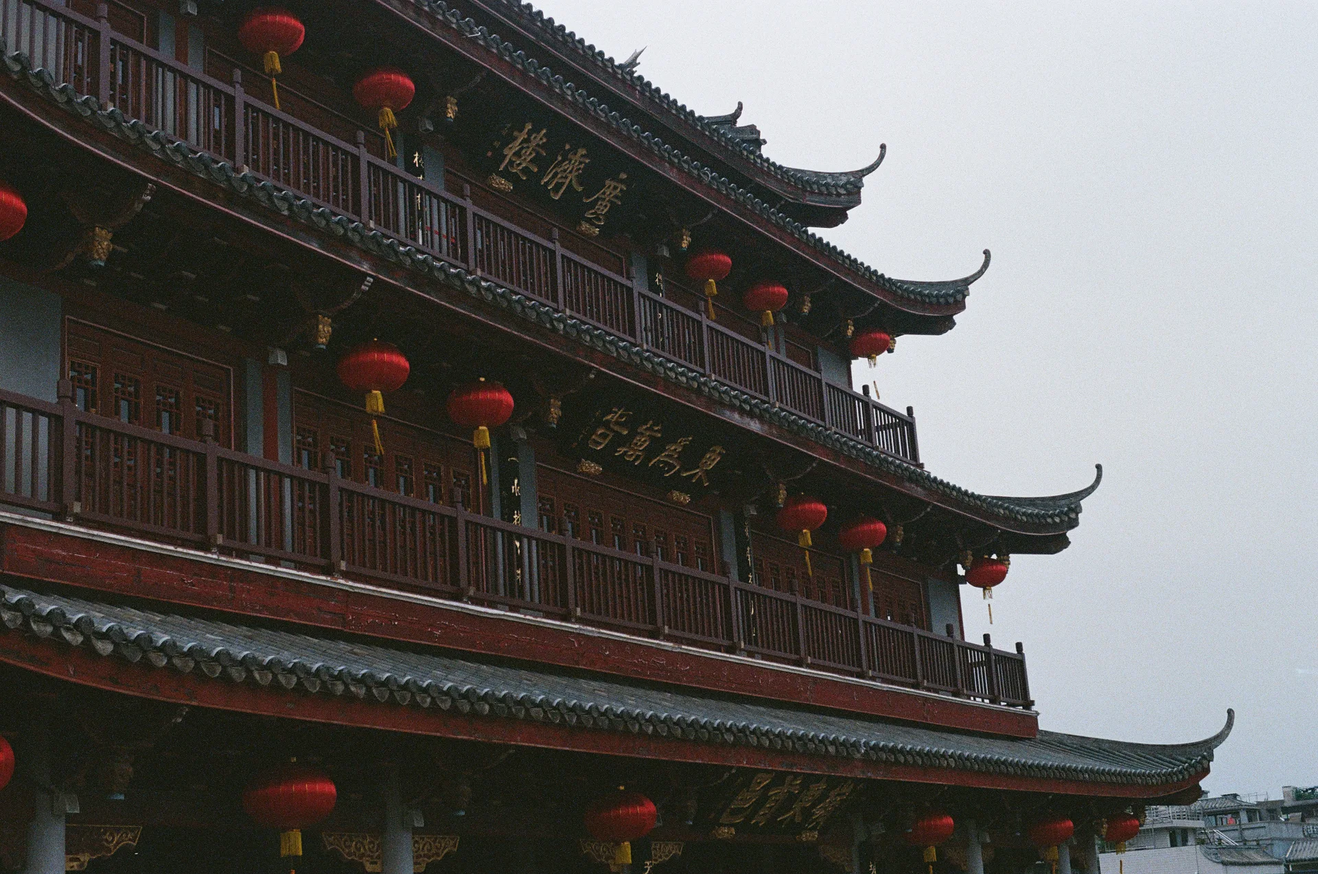 Traditional building with curved roofs and red lanterns in Chaozhou