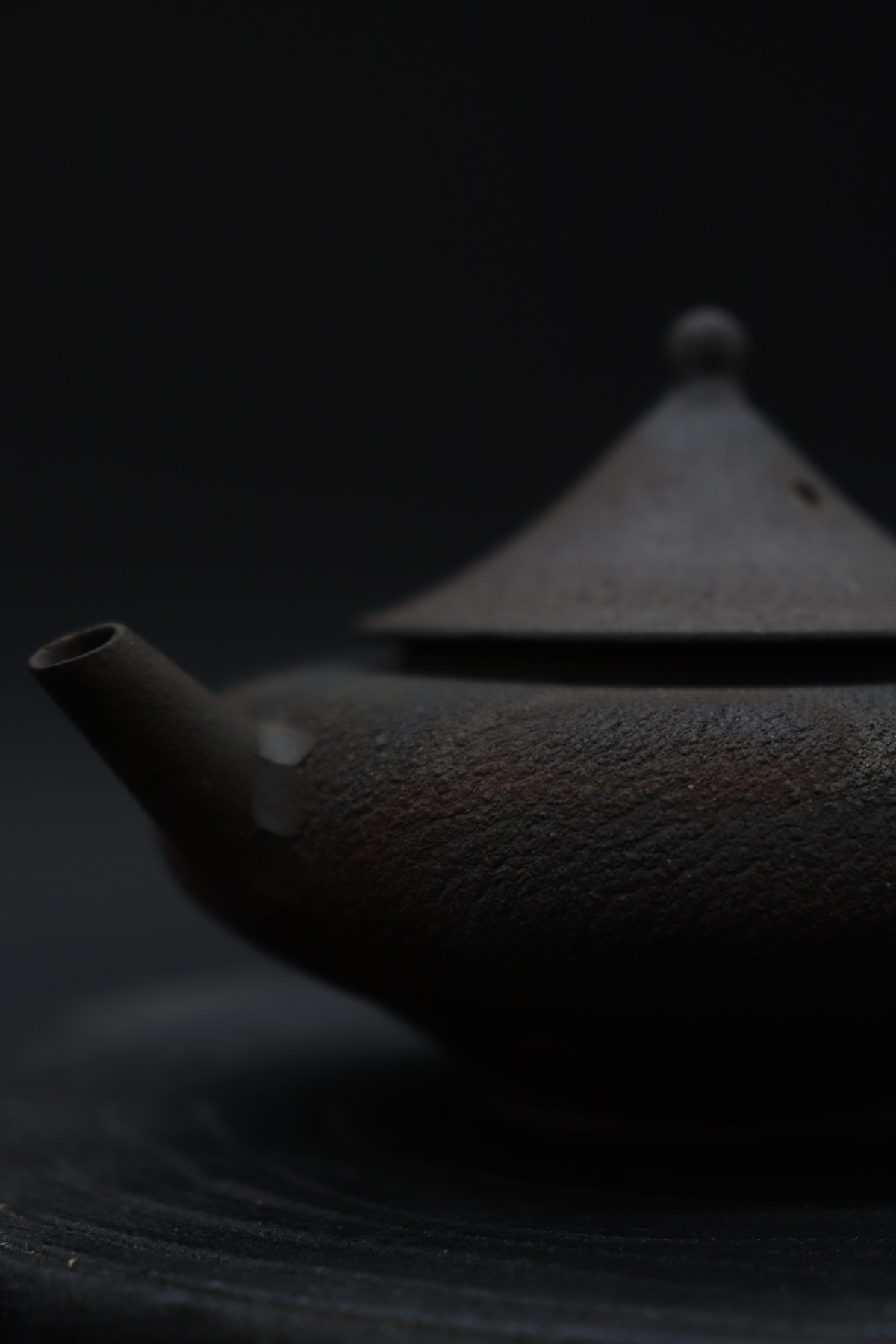 Close view of the Lamp Teapot surface and spout