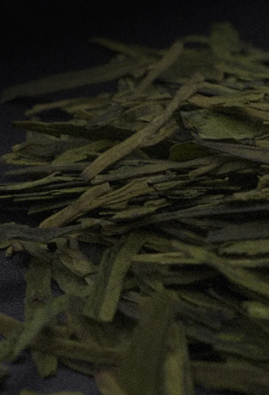Close up of Zhejiang Long Jing green tea leaves