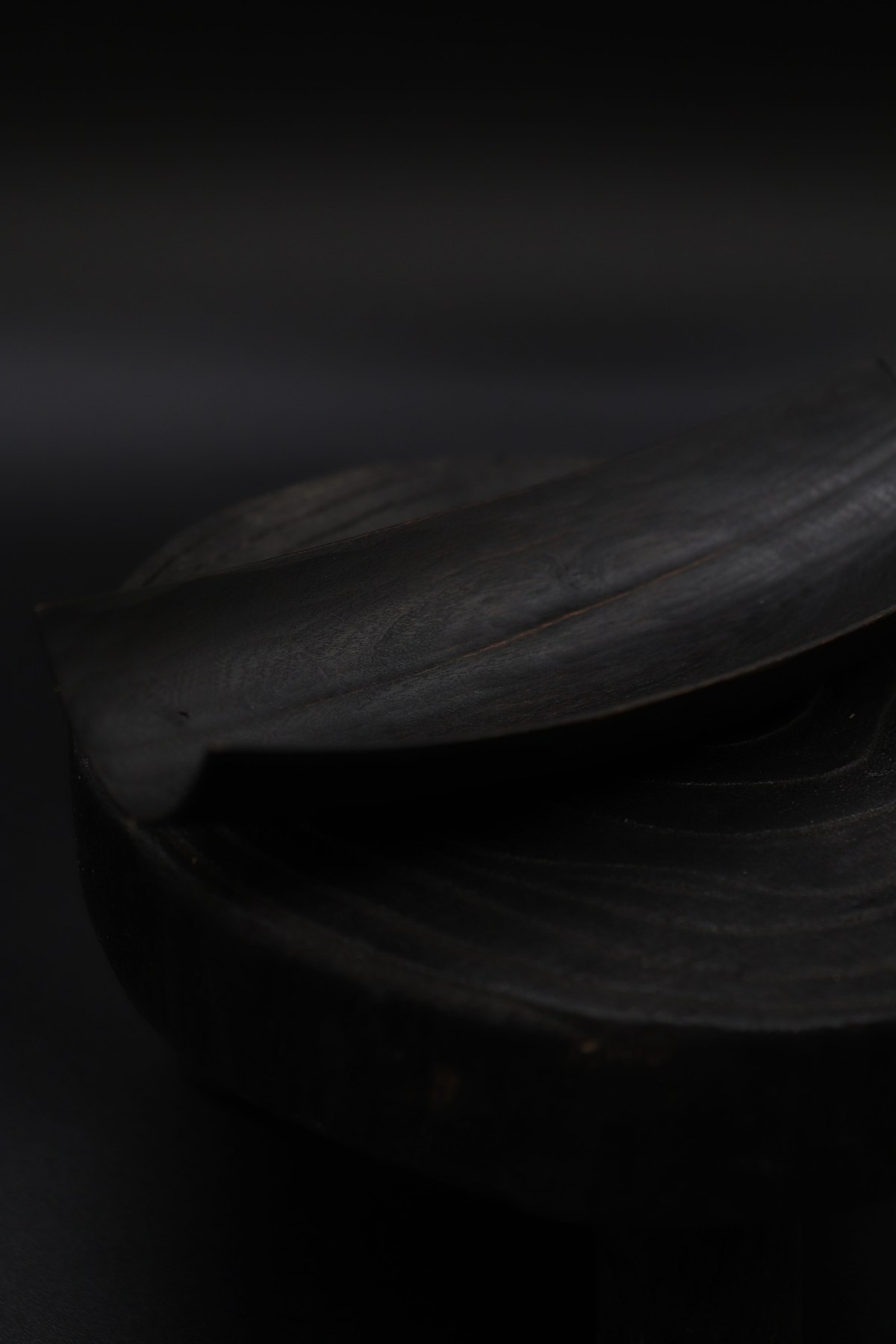 Close view of the carved wooden Tea Measure