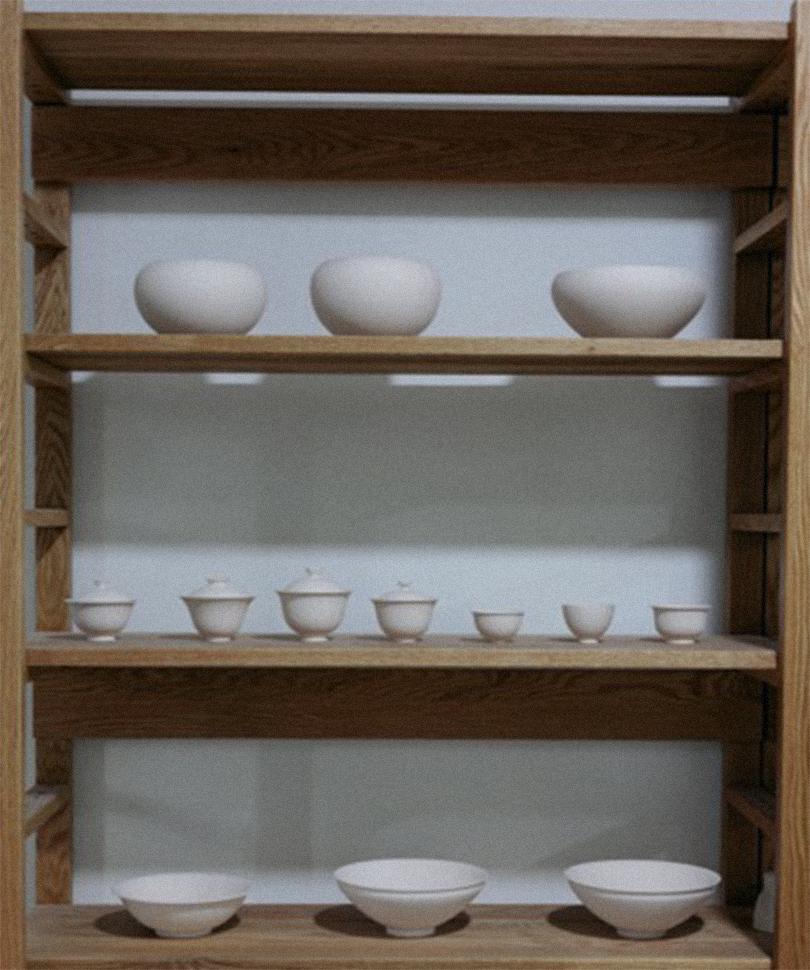 Bowls and gaiwans on wooden studio shelves