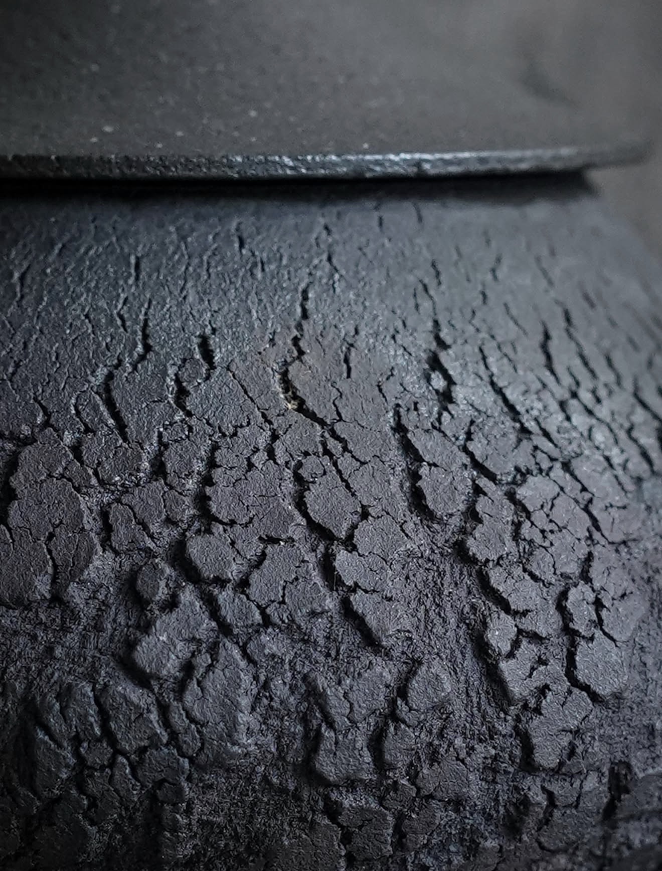 Close-up of the textured clay beneath a teapot lid