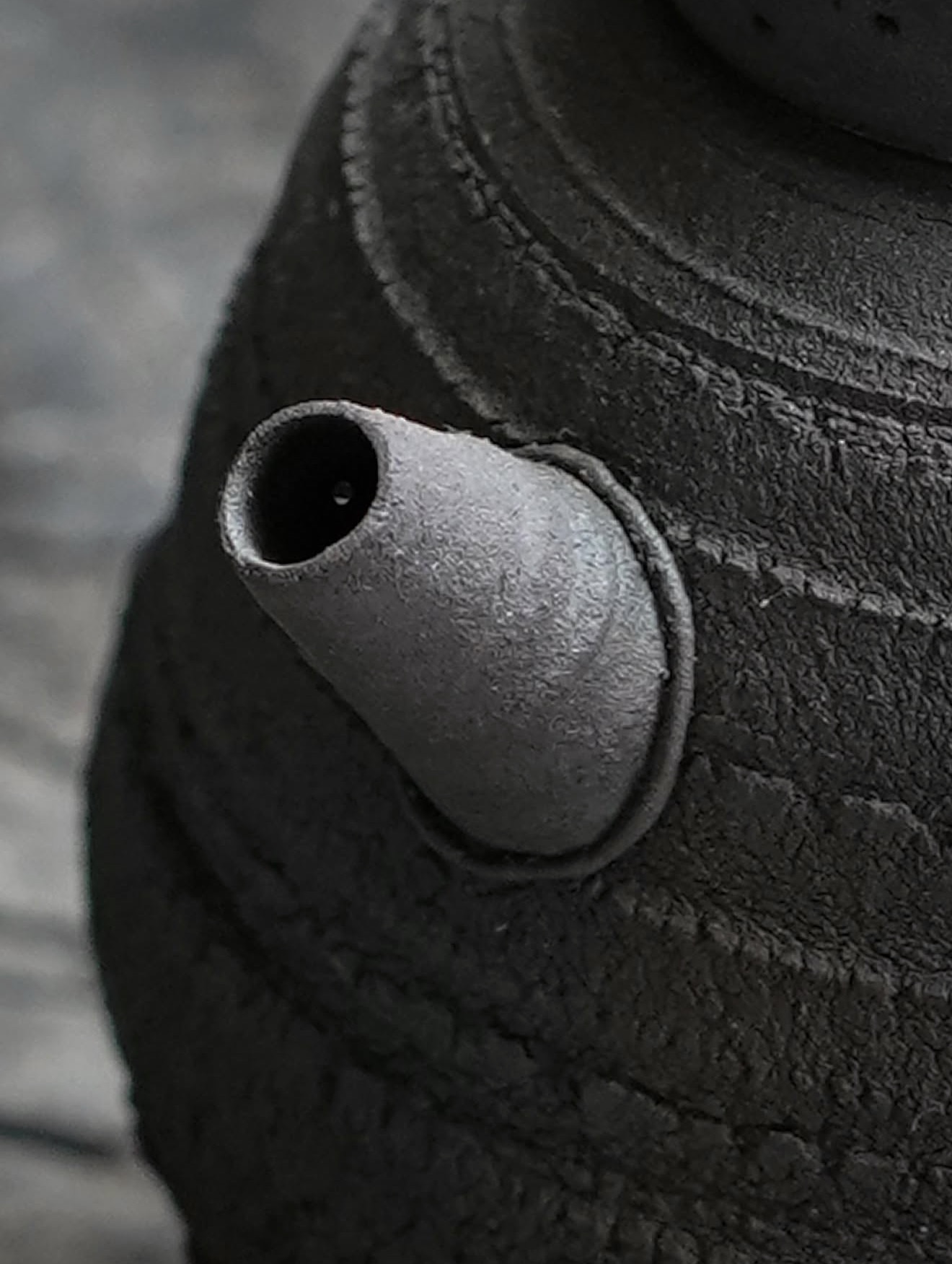 Teapot spout and weathered ceramic texture