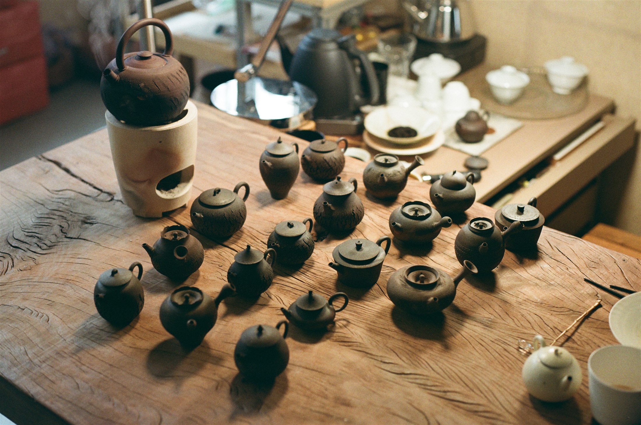 Yizhi teapot collection arranged on a wooden table